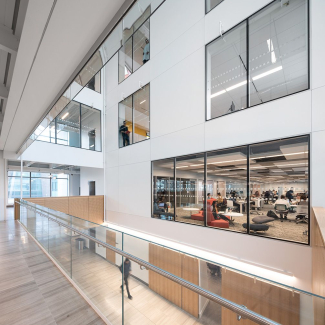 Driven by sunlight, flexible co-working spaces, labs and lecture theatres are centred around a light-filled atrium. The atrium functions as a social space that encourages formal and informal gatherings.