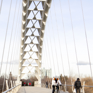 Cyclists and pedestrians utilizing the bridge during the colder seasons.